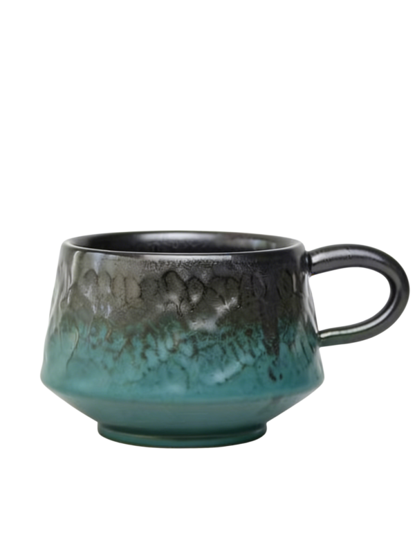 Finished handmade ceramic cup after glazing and kiln firing