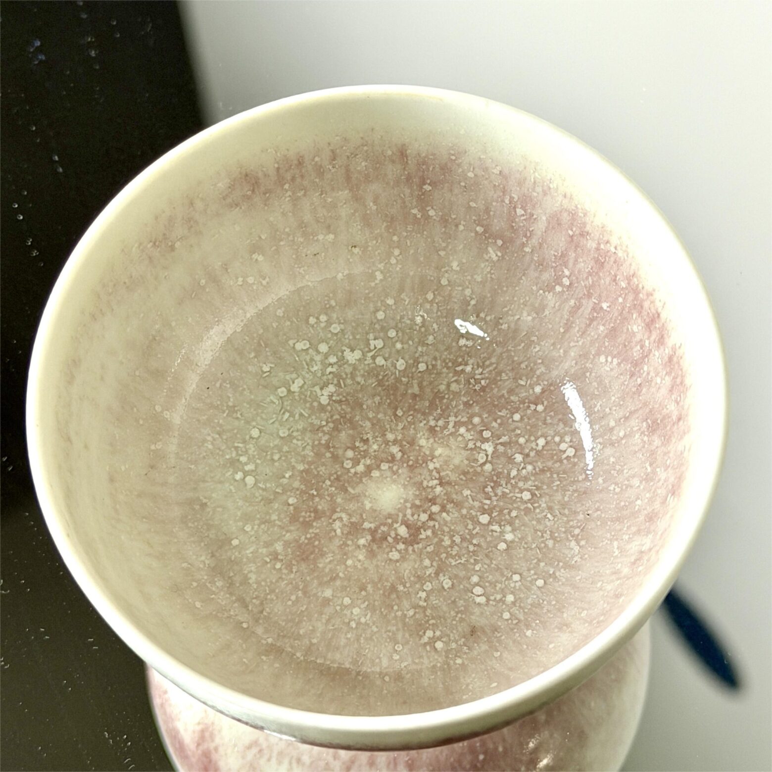 inside of handmade tea cup showing natural crystalline glaze pattern, small 90ml ceramic cup